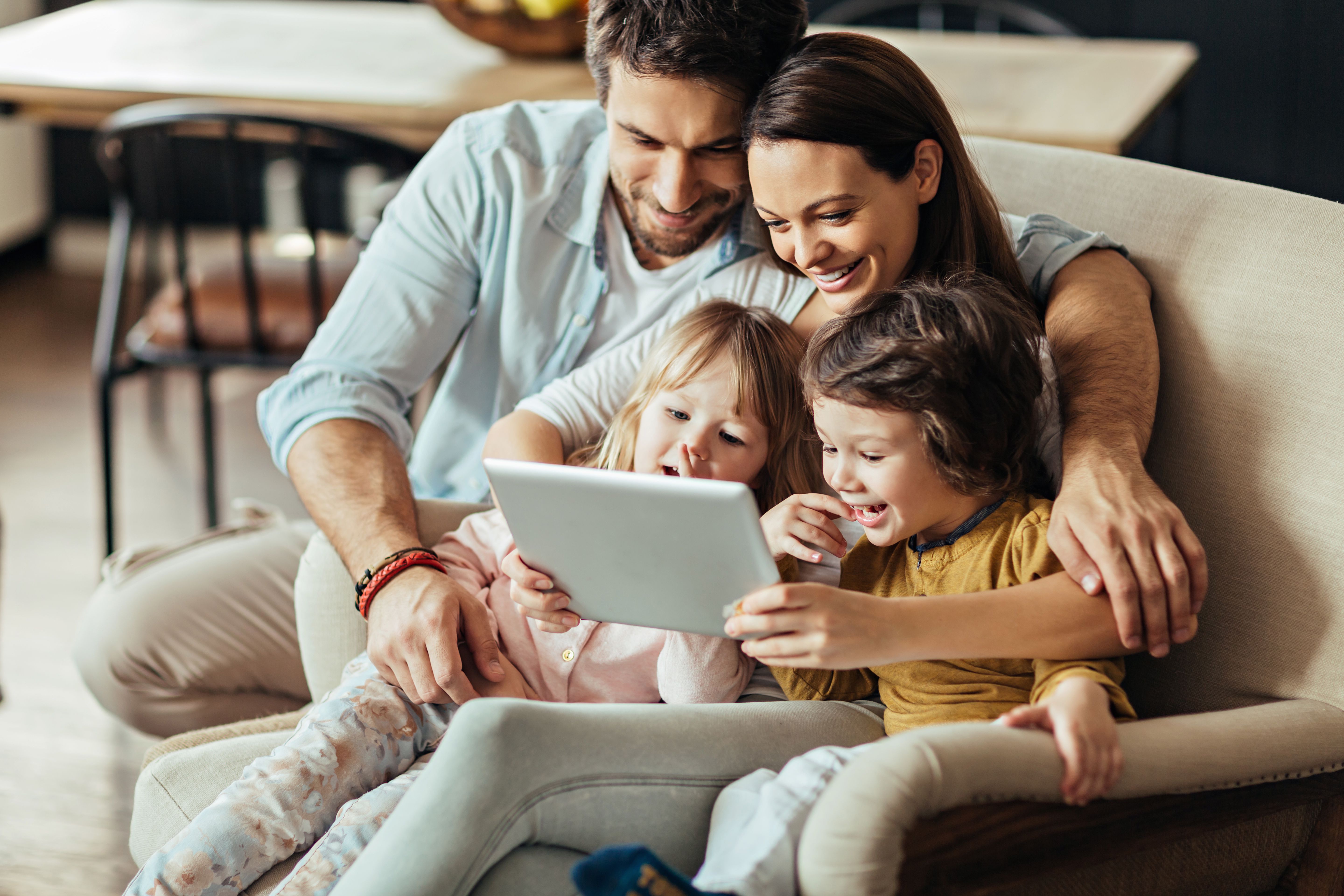 Family sharing a tablet together